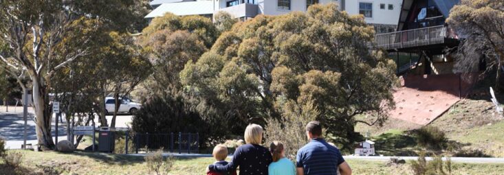 Family overlooking thredbo pond