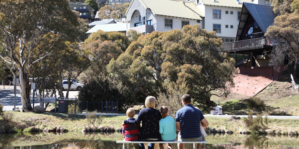 Family overlooking thredbo pond