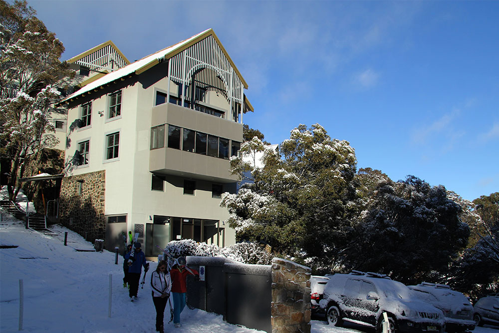 Skiers enjoying the short walk from Boali Lodge to Thredbo's chairlift